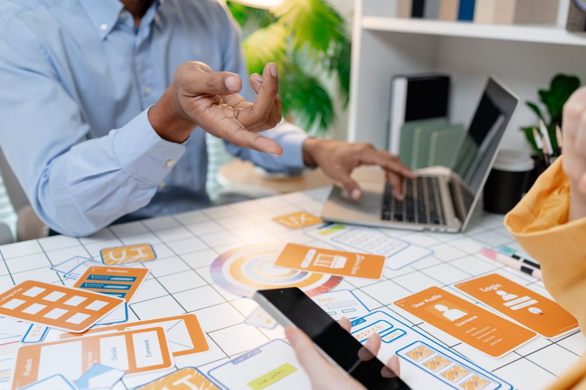 UX designer presenting wireframes and interface layouts in a workshop
